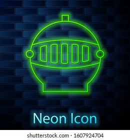 Glowing neon line Medieval iron helmet for head protection icon isolated on brick wall background.  Vector Illustration