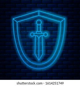 Glowing neon line Medieval shield with sword icon isolated on brick wall background.  Vector Illustration