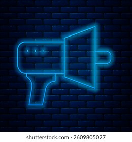 Glowing neon line Megaphone icon isolated on brick wall background. Speaker sign.  Vector