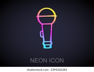 Glowing neon line Microphone icon isolated on black background. On air radio mic microphone. Speaker sign.  Vector