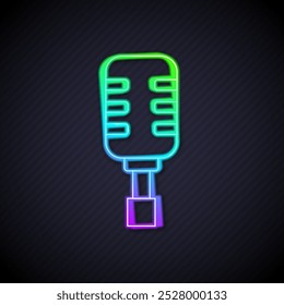 Glowing neon line Microphone icon isolated on black background. On air radio mic microphone. Speaker sign.  Vector