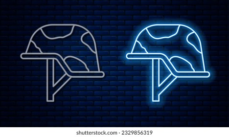 Glowing neon line Military helmet icon isolated on brick wall background. Army hat symbol of defense and protect. Protective hat.  Vector