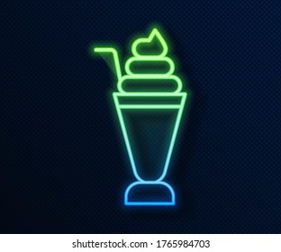 Glowing neon line Milkshake icon isolated on blue background. Plastic cup with lid and straw.  Vector