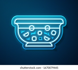 Glowing neon line Mixed punch with fresh fruits in bowl icon isolated on blue background.  Vector Illustration