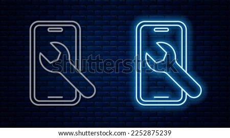 Glowing neon line Mobile phone with wrench icon isolated on brick wall background. Adjusting, service, setting, maintenance, repair.  Vector