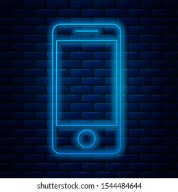 Glowing neon line Mobile smart phone with app delivery tracking icon isolated on brick wall background. Parcel tracking.  Vector Illustration