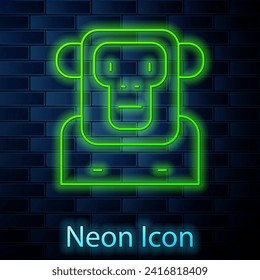 Glowing neon line Monkey icon isolated on brick wall background.  Vector