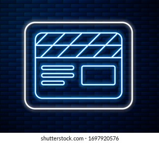 Glowing neon line Movie clapper icon isolated on brick wall background. Film clapper board. Clapperboard sign. Cinema production or media industry.  Vector Illustration
