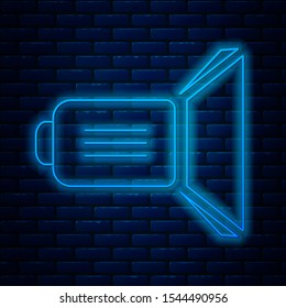 Glowing neon line Movie spotlight icon isolated on brick wall background. Light Effect. Scene, Studio, Show.  Vector Illustration