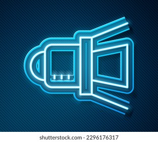 Glowing neon line Movie spotlight icon isolated on blue background. Light Effect. Scene, Studio, Show.  Vector