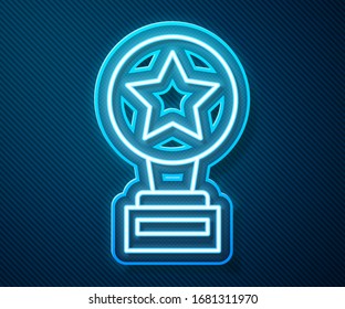 Glowing neon line Movie trophy icon isolated on blue background. Academy award icon. Films and cinema symbol.  Vector Illustration