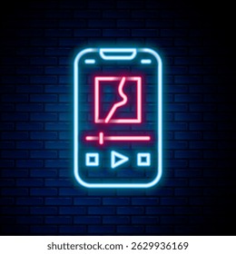 Glowing neon line Music player icon isolated on brick wall background. Portable music device. Colorful outline concept. Vector
