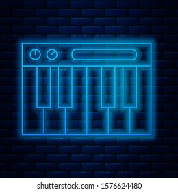 Glowing neon line Music synthesizer icon isolated on brick wall background. Electronic piano.  Vector Illustration