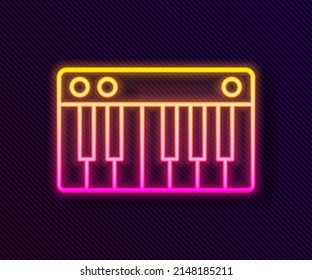 Glowing neon line Music synthesizer icon isolated on black background. Electronic piano.  Vector Illustration