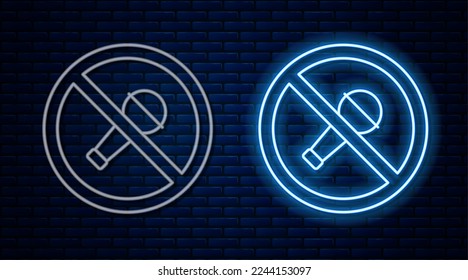 Glowing neon line Mute microphone icon isolated on brick wall background. Microphone audio muted.  Vector
