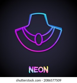Glowing neon line Necklace on mannequin icon isolated on black background.  Vector