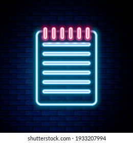 Glowing neon line Notebook icon isolated on brick wall background. Spiral notepad icon. Writing pad. Diary for business. Notebook cover design. Colorful outline concept. Vector