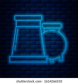 Glowing neon line Oil and gas industrial factory building icon isolated on brick wall background.  Vector Illustration