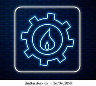 Glowing neon line Oil and gas industrial factory building icon isolated on brick wall background.  Vector Illustration