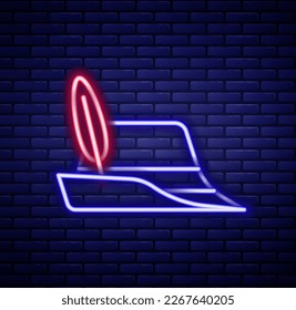 Glowing neon line Oktoberfest hat icon isolated on brick wall background. Hunter hat with feather. German hat. Colorful outline concept. Vector