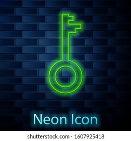 Glowing neon line Old key icon isolated on brick wall background.  Vector Illustration