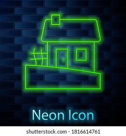 Glowing neon line Old Ukrainian house hut icon isolated on brick wall background. Traditional village house. Vector.