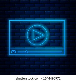 Glowing neon line Online play video icon isolated on brick wall background. Film strip with play sign.  Vector Illustration