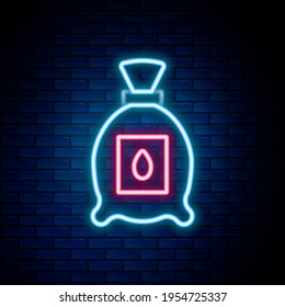Glowing neon line Pack full of seeds of a specific plant icon isolated on brick wall background. Colorful outline concept. Vector