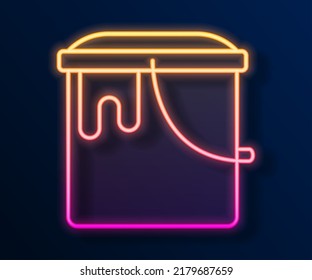 Glowing neon line Paint bucket icon isolated on black background.  Vector