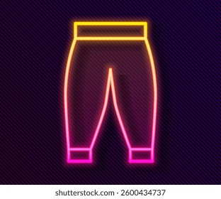 Glowing neon line Pants icon isolated on black background. Trousers sign.  Vector