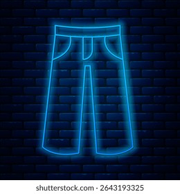 Glowing neon line Pants icon isolated on brick wall background. Trousers sign.  Vector