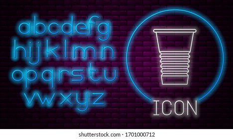 Glowing neon line Paper glass icon isolated on brick wall background. Soda drink glass. Fresh cold beverage symbol. Neon light alphabet. Vector Illustration