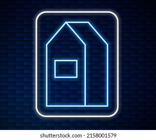 Glowing neon line Paper package for milk icon isolated on brick wall background. Milk packet sign.  Vector