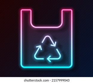 Glowing neon line Paper shopping bag with recycle icon isolated on black background. Bag with recycling symbol.  Vector