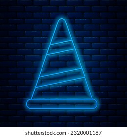 Glowing neon line Party hat icon isolated on brick wall background. Birthday hat. Merry Christmas and Happy New Year.  Vector