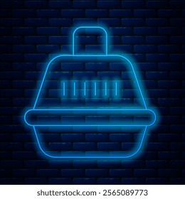 Glowing neon line Pet carry case icon isolated on brick wall background. Carrier for animals, dog and cat. Container for animals. Animal transport box.  Vector