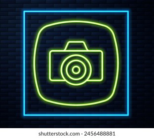 Glowing neon line Photo camera icon isolated on brick wall background. Foto camera. Digital photography.  Vector