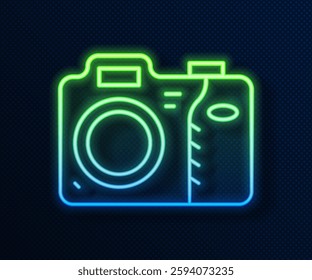 Glowing neon line Photo camera icon isolated on blue background. Foto camera icon.  Vector