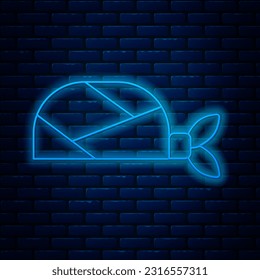 Glowing neon line Pirate bandana for head icon isolated on brick wall background.  Vector