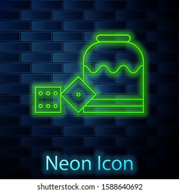 Glowing neon line Pirate game dice icon isolated on brick wall background. Casino gambling.  Vector Illustration