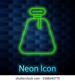 Glowing neon line Pirate sack icon isolated on brick wall background.  Vector Illustration