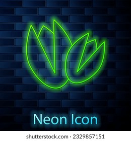 Glowing neon line Pistachio nuts icon isolated on brick wall background.  Vector