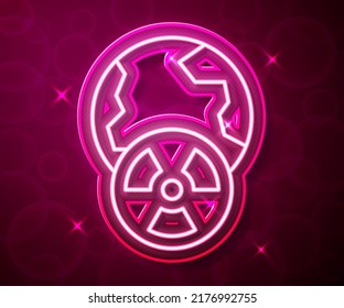 Glowing neon line Planet earth and radiation symbol icon isolated on red background. Environmental concept.  Vector