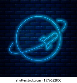 Glowing neon line Planet icon isolated on brick wall background.  Vector Illustration