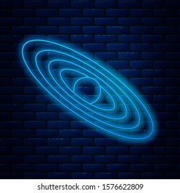 Glowing neon line Planet icon isolated on brick wall background.  Vector Illustration