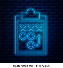 Glowing neon line Planning strategy concept icon isolated on brick wall background. Soccer or american football cup formation and tactic.  Vector Illustration