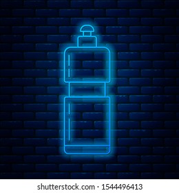 Glowing neon line Plastic bottle for liquid laundry detergent, bleach, dishwashing liquid or another cleaning agent icon isolated on brick wall background.  Vector Illustration