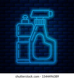 Glowing neon line Plastic bottles for liquid laundry detergent, bleach, dishwashing liquid or another cleaning agent icon isolated on brick wall background.  Vector Illustration