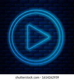 Glowing neon line Play in circle icon isolated on brick wall background.  Vector Illustration