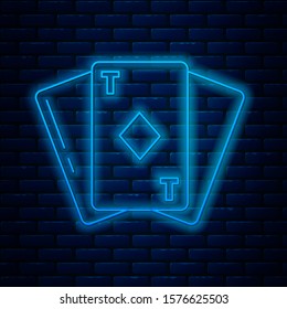 Glowing neon line Playing card with diamonds symbol icon isolated on brick wall background. Casino gambling.  Vector Illustration